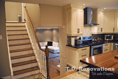Kitchen - traditional kitchen idea in Montreal with granite countertops