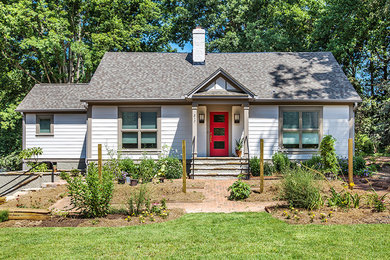 Transitional white two-story concrete fiberboard gable roof idea in Other