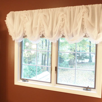 Chocolate brown nursery with sheer white balloon valance