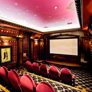 Inspiration for a large enclosed home cinema in Dallas with pink walls, carpet and a projector screen.