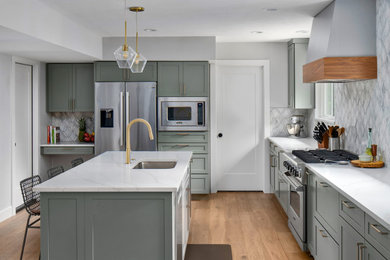 Example of a transitional kitchen design in Austin with shaker cabinets and green cabinets