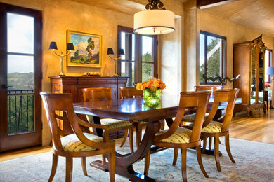 Photo of a large transitional open plan dining in Los Angeles with medium hardwood floors.