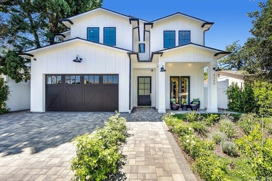 Inspiration for a cottage white two-story wood house exterior remodel in Los Angeles