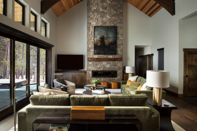 Inspiration for a large transitional medium tone wood floor and wood ceiling living room remodel in Portland with a standard fireplace and a stacked stone fireplace