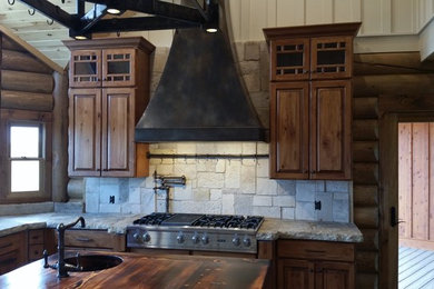 Mountain style home design photo in Other