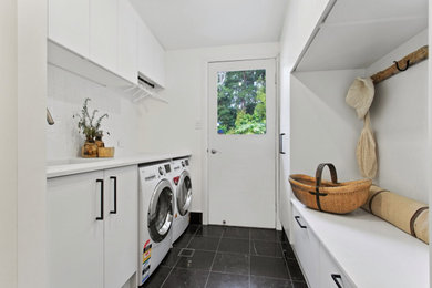 Photo of an eclectic laundry room in Sunshine Coast.