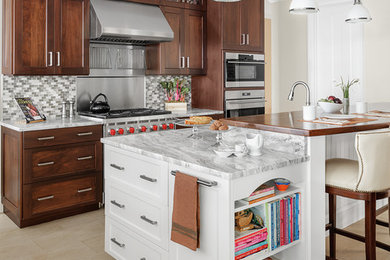 Enclosed kitchen - large transitional l-shaped slate floor and beige floor enclosed kitchen idea in Other with an undermount sink, shaker cabinets, medium tone wood cabinets, marble countertops, white backsplash, mosaic tile backsplash, stainless steel appliances and an island