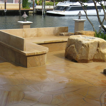 Stone bench and boulder fire pit in Lighthouse Point Florida