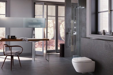 Expansive modern bathroom in Chicago with an open shower, a wall-mount toilet and grey walls.