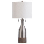 StyleCraft - Logan Table Lamp Brushed Steel Finish Heathered White Fabric Shade - This contemporary table lamp turns a familiar form into a piece of innovative art. A bottle-shaped base made of metal and polyresin gives way to a heathered linen shade in a classic drum. The resin features a faux-wood finish and a metal section colored with brushed steel, giving the fixture a two-tone look that's both rustic and classy.