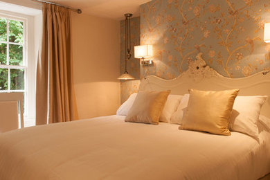 This is an example of a medium sized modern guest bedroom in Other with beige walls.