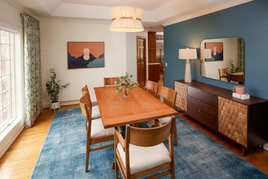 This is an example of a midcentury dining room in Other.
