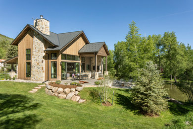 Inspiration for a mid-sized country two-storey house exterior in Denver.
