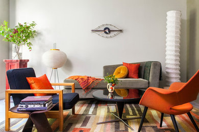 Inspiration for a mid-sized midcentury formal open concept living room in San Francisco with beige walls, carpet, no fireplace, no tv and multi-coloured floor.
