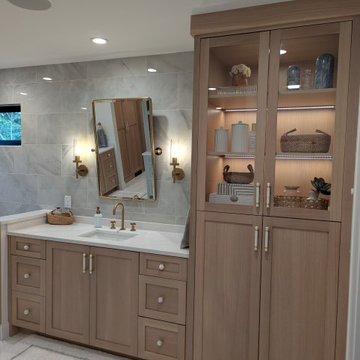 Amish Frameless White oak primary bath and closet with painted vanity