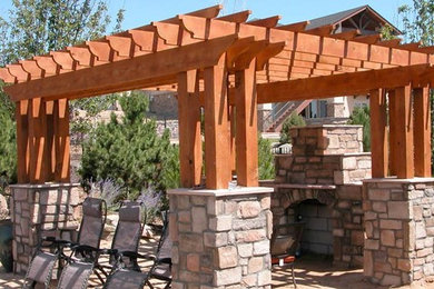 This is an example of a mid-sized country backyard patio in Denver with a gazebo/cabana.