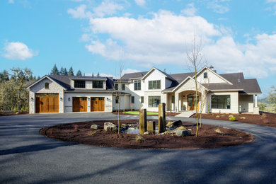 Transitional gray two-story mixed siding gable roof idea in Other with a shingle roof and a black roof