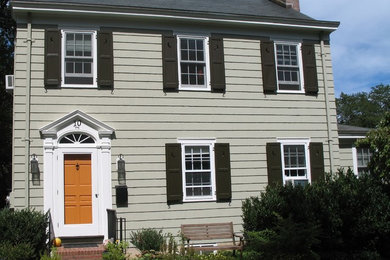 Mid-sized traditional beige two-story wood exterior home idea in New York with a shingle roof