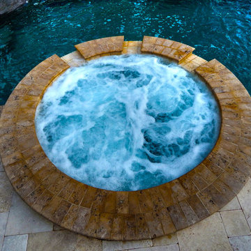 Curved Pool with Fountain and Pergola