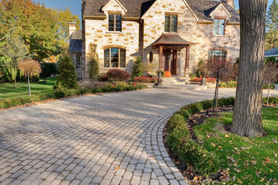 Mid-sized transitional beige two-story stone exterior home idea in DC Metro with a shingle roof