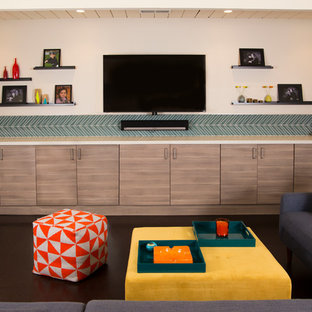 Small midcentury enclosed home cinema in San Francisco with beige walls, cork flooring, a wall mounted tv and brown floors.
