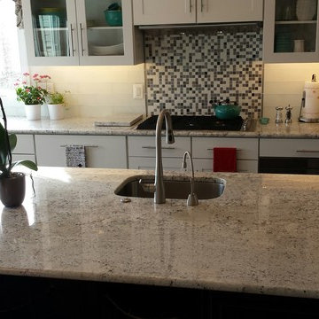 White Ice granite kitchen by The Beveled Edge