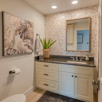 Coastal Bathroom with Mosaic Backsplash and Glass Shower