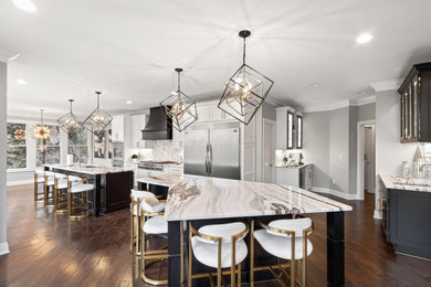 Inspiration for a huge contemporary u-shaped eat-in kitchen remodel in Columbus with shaker cabinets and two islands