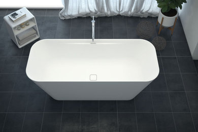 Immagine di una stanza da bagno padronale minimalista di medie dimensioni con ante bianche, vasca freestanding e mobile bagno freestanding