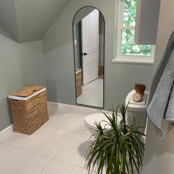 Toilet area separated by one of the shower walls