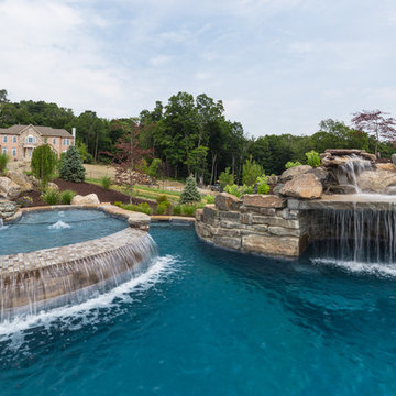 Infinity Edge Pool with Sun Ledge, Grotto, Waterfall & Floating Steps