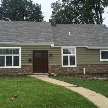 Levittown Siding - Arbor Shakes with Terra Rosa Ledgestone and Mahogany Door