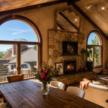 Breakfast Room With Stone Fireplace and Hillside Arched Windows