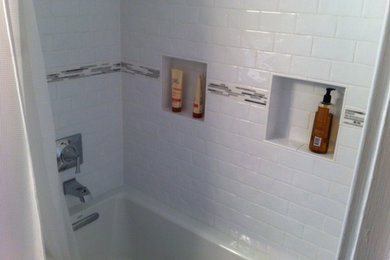 Mid-sized 3/4 beige tile and ceramic tile ceramic tile bathroom photo in New York with open cabinets, distressed cabinets, beige walls, a drop-in sink and quartzite countertops