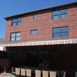 Total Eclipse by Eclipse Awning Covering Massive Table. - Awnings