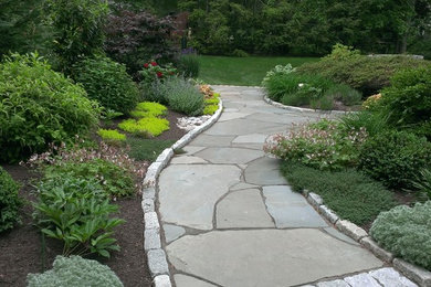 Inspiration for a large transitional full sun backyard stone garden path in Philadelphia.