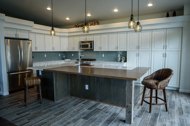 Example of a transitional kitchen design in Denver