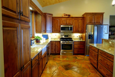 Open concept kitchen - mid-sized rustic l-shaped slate floor open concept kitchen idea in Charlotte with a farmhouse sink, raised-panel cabinets, dark wood cabinets, granite countertops, multicolored backsplash, ceramic backsplash, stainless steel appliances and a peninsula