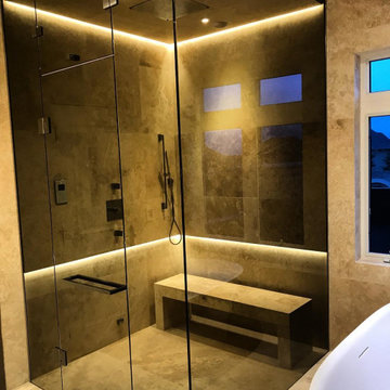 Frameless Steam Shower Enclosure — Stone Surround
