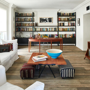 Mid-sized transitional open concept medium tone wood floor and brown floor family room photo in Los Angeles with white walls and a wall-mounted tv