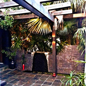 Front entry Asian patio with koi pond