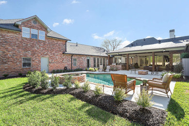 Design ideas for a mid-sized traditional full sun backyard landscaping in Other.