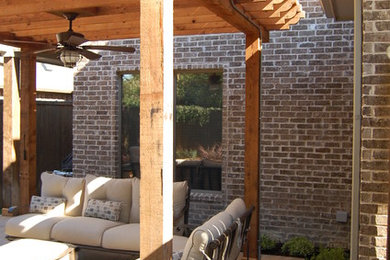 Design ideas for a large traditional backyard concrete paver landscaping in Dallas.