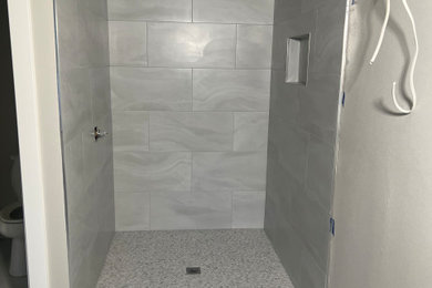 Bathroom floor walls and curb tile install