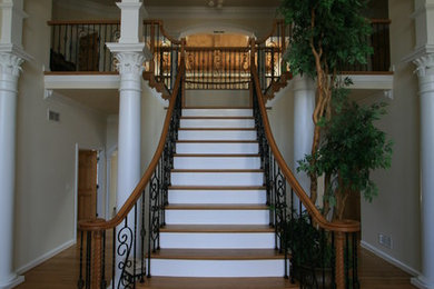 Inspiration for a mid-sized timeless wooden straight metal railing staircase remodel in Baltimore with painted risers