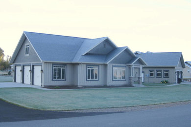 Mid-sized craftsman gray concrete fiberboard gable roof idea in Other
