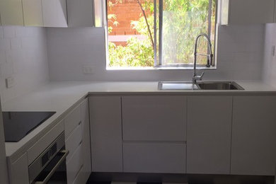 This is an example of a small modern kitchen in Sydney.