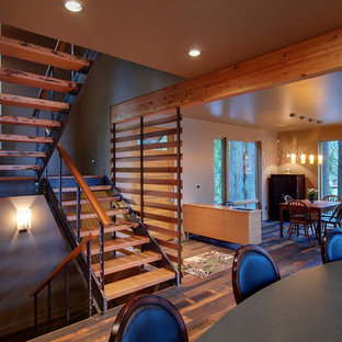 Example of a trendy wooden u-shaped open staircase design in Other