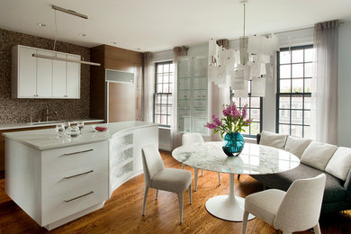 Eat-in kitchen - large modern single-wall eat-in kitchen idea in Boston with flat-panel cabinets, medium tone wood cabinets, quartz countertops and an island