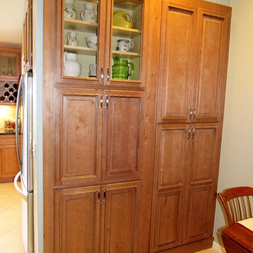 Galaxy Pecan cabinets with peacock green granite